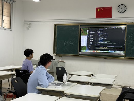 Two students at an after-school algorithm tutorial